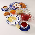 Traditional Afternoon Tea Spread With Lemon Slices Cookies Cupcakes And Jam