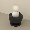 Decorative Lamp with White Spherical Shade and Black Petal Shaped Base in Modern Minimalist Design