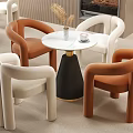Modern Single Sofa Design In Orange And White With Curved Arms And Round Coffee Table