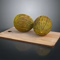 Two Fresh Yellow Green Striped Melons Placed on a Wooden Cutting Board