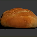 Freshly Baked Golden Oval Bread Loaf With Scored Surface And Crispy Crust