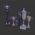 Various Trophy Collection Display With Silver And Gold Metal Designs And Spiral Wooden Bases