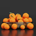 Fresh Oranges With Green Leaves In A Decorative Bowl On