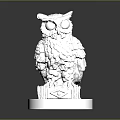 Silver Metallic Owl Sculpture With Intricate Carved Details And Decorative Base