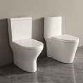 Modern White Toilets With Sleek Design Against Wall On Gray Floor