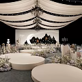Elegant Banquet Hall With White Drapes Chandeliers Stage Moon Silhouette And Floral Decor