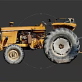 Yellow Vintage Farm Tractor With Large Wheels And Rustic Metal Body