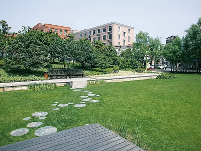 Park Landscape Featuring Green Lawn Circular Stone Stepping Stones Wooden Deck Bench Trees And Buildings 3d model