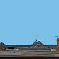 Scenic Coastal View With Naval Ship Orange Lighthouse And Sailboat Under Blue Sky