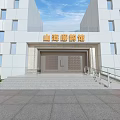 Entrance Gate Of White Modern Museum Building With Golden Plaque Steps And Green Shrubs