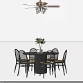 Circular Dining Table Set Featuring Six Chairs Potted Plant And Ceiling Fan