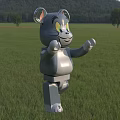 Gray Cat Shaped Lego Style Doll Standing On Green Grass Field With Trees And Mountain