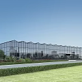 Modern Industrial Factory Building With Large Glass Curtain Walls Surrounding Greenery Lawn And Bushes