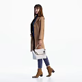 Woman Wearing Brown Coat With Dark Blue Top Blue Jeans And White Handbag