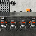 Industrial Style Gray Metal Table With Orange Seat Black Leg Chairs In Modern Workspace