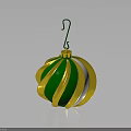 Shiny Green And Gold Striped Christmas Ornament With Hanger On Black Surface