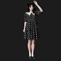 A Woman In Black Polka Dot Dress Black Hat White Socks And Black Shoes