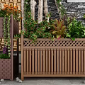 Decorative Wooden Garden Planters With Various Plants Different Sizes And Stone Accents