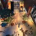 Bustling Commercial Street With Pedestrians Shops Greenery Outdoor Seating And Illuminated Storefronts
