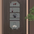 Traditional Chinese Decorative Cabinet With Red Lanterns Vase Black Ornament Fan And Green Plant