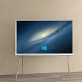Modern TV Displaying Starry Galaxy With Windows Logo On Light Colored Wall Metal Stand