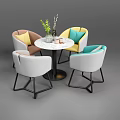 Modern Minimalist Round Table And Chair Set With Colorful Cushioned Chairs And Vase Plant