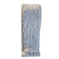 White Decorative Component With Intricate Leaf Carvings And Ornate Design