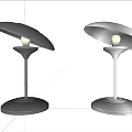 Sleek Modern Table Lamp With Transparent Lampshade Silver Base And Warm Glow
