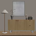 Modern Wooden Console Cabinet With Drawers Doors And Wheels Featuring Floor Lamp Vase And Artwork