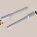 Two Silver Cylindrical Industrial Components With Golden Connecting Parts For Mechanical Applications