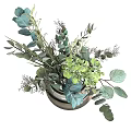 Elegant Transparent Glass Vase With Green Gray Blue Foliage Arrangement