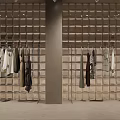 Modern Clothing Store Interior With Mannequins Clothes Racks And Green Plants