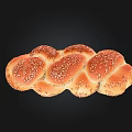 Freshly Baked Braided Bread With Golden Brown Surface And Sesame Seeds