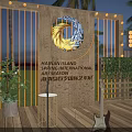 Outdoor Stage at Night with Illuminated Wooden Structure and Green Plants for Live Performance