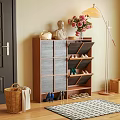 Wooden Shoe Cabinet With Multiple Compartments Holding Shoes And Decorative Flowers Statue