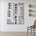 Wall Art With City Names And Chair With Books In Modern Interior