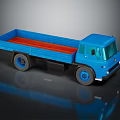 Blue Toy Truck with Open Flatbed Red Interior on Reflective Surface 3d model