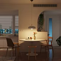 Warm Modern Dining And Living Space With Round Table Wooden Chairs And Soft Ambient Lighting