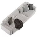 Modern Light Gray Sectional Sofa With Soft Pillows And Dark Throw Blanket 3d model