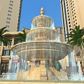 Multi tiered Garden Ornament Fountain With Flowing Water Palm Trees And High Rise Buildings