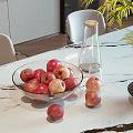 Fresh Red Apples in Glass Bowl on Marble Table with Potted Plant and Glass Bottle