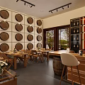 Elegant Wine Cellar Interior With Wooden Racks Barrels Bar Counter And Sofa