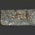 Outdoor Stone Wall Construction With Irregular Mixed Color Stones And Concrete Base
