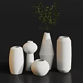 Textured White Vases with Green Foliage in Various Shapes for Home Decor