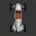 Vintage Silver Race Car With Orange Steering Wheel And Black Tires