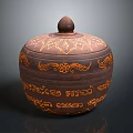 Brown Lidded Container With Intricate Orange Patterns And Traditional Carvings