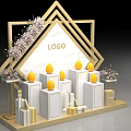 Golden Geometric Frame Exhibition Setup With LOGO White Pedestals Yellow Egg Decor And Floral Arrangements