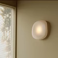 Modern White Irregular Shape Wall Lamp On Beige Wall With Window Blinds And Soft Lighting 3d model