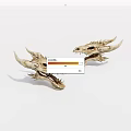 Two Detailed Dragon Skull Sculptures With Sharp Horns And Fangs