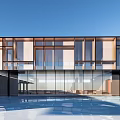 Modern Sales Office Building With Glass Curtain Wall And Front Swimming Pool Under Blue Sky